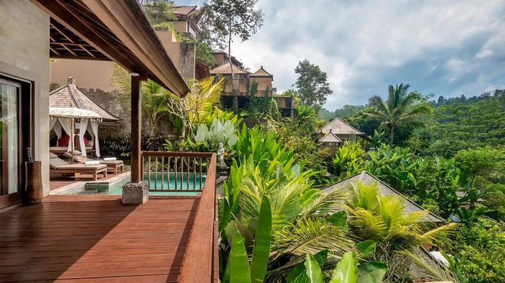 A luxurious private villa balcony overlooking a lush jungle landscape in Ubud, Bali.