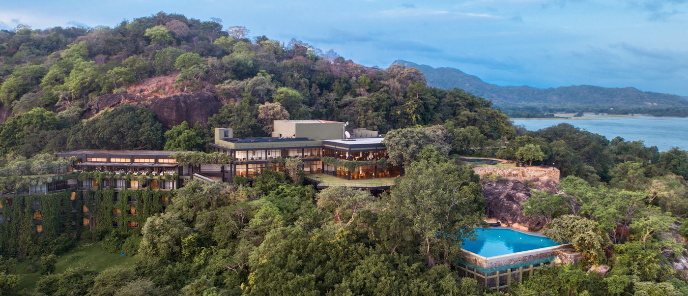 Heritance Kandalama hotel, blending into lush green hills of Sigiriya, Sri Lanka, features an infinity pool.