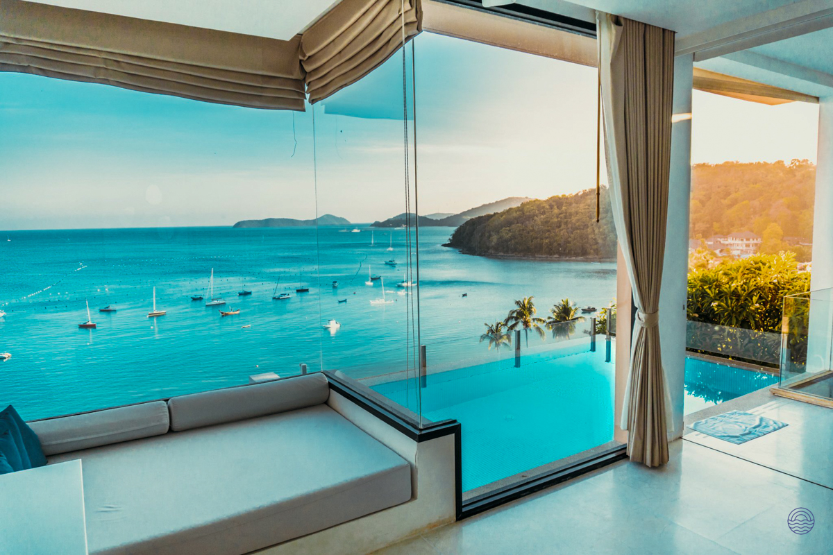 A luxurious villa in Phuket offers stunning ocean views and a private infinity pool.