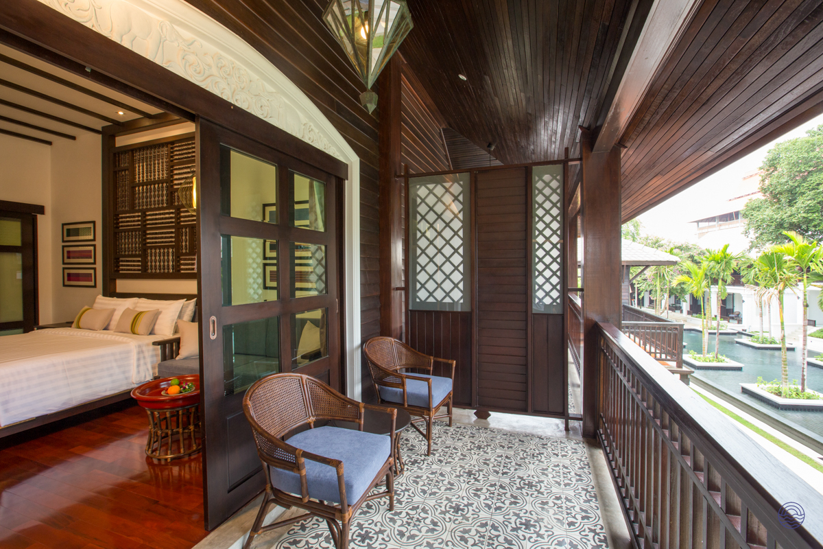 Relax on your private balcony, enjoying the serene resort pool and gardens in Chiang Mai.