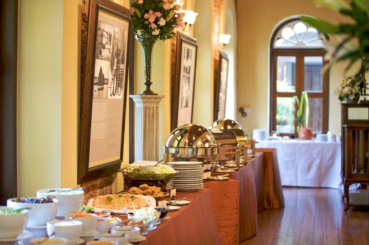 An elegant buffet spread with delicious Thai dishes in a beautiful Bangkok hotel dining room.