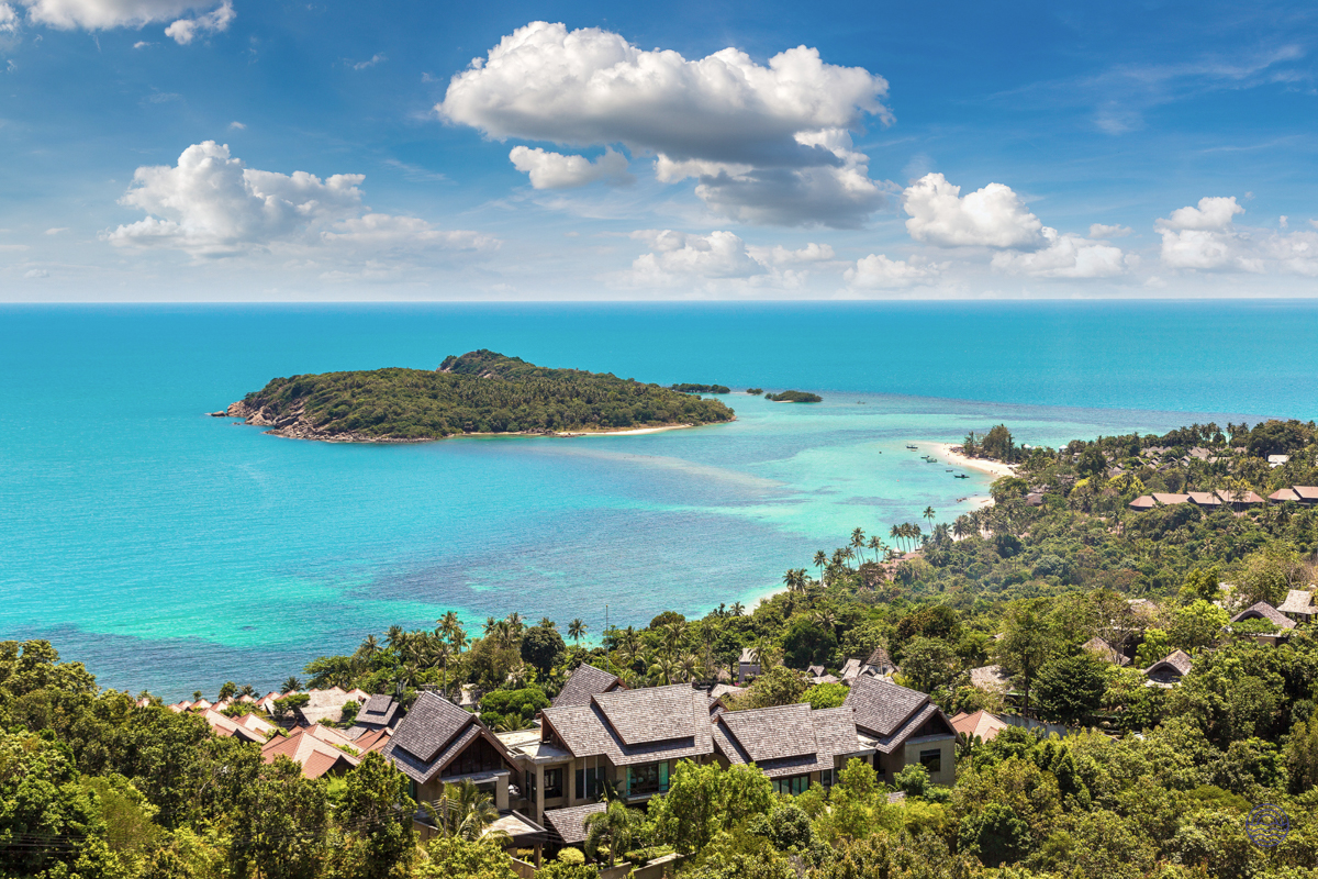 Luxurious villas on a lush hillside overlooking the turquoise waters and tropical islands of Koh Samui.