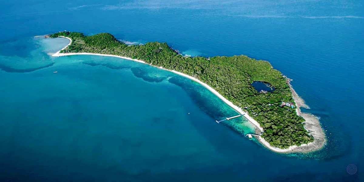 Stunning aerial view of Koh Tan, a lush tropical island with white beaches and a hidden lagoon.