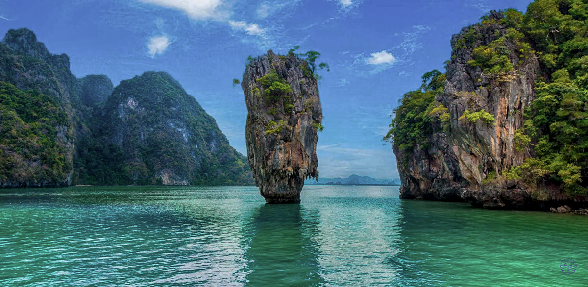 Dramatic limestone islands rise from the emerald waters, a stunning scene typical of Krabi's coastal beauty.