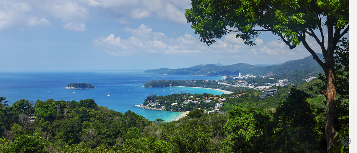 Stunning panoramic view of Phuket's beautiful beaches and clear turquoise ocean from a scenic viewpoint.
