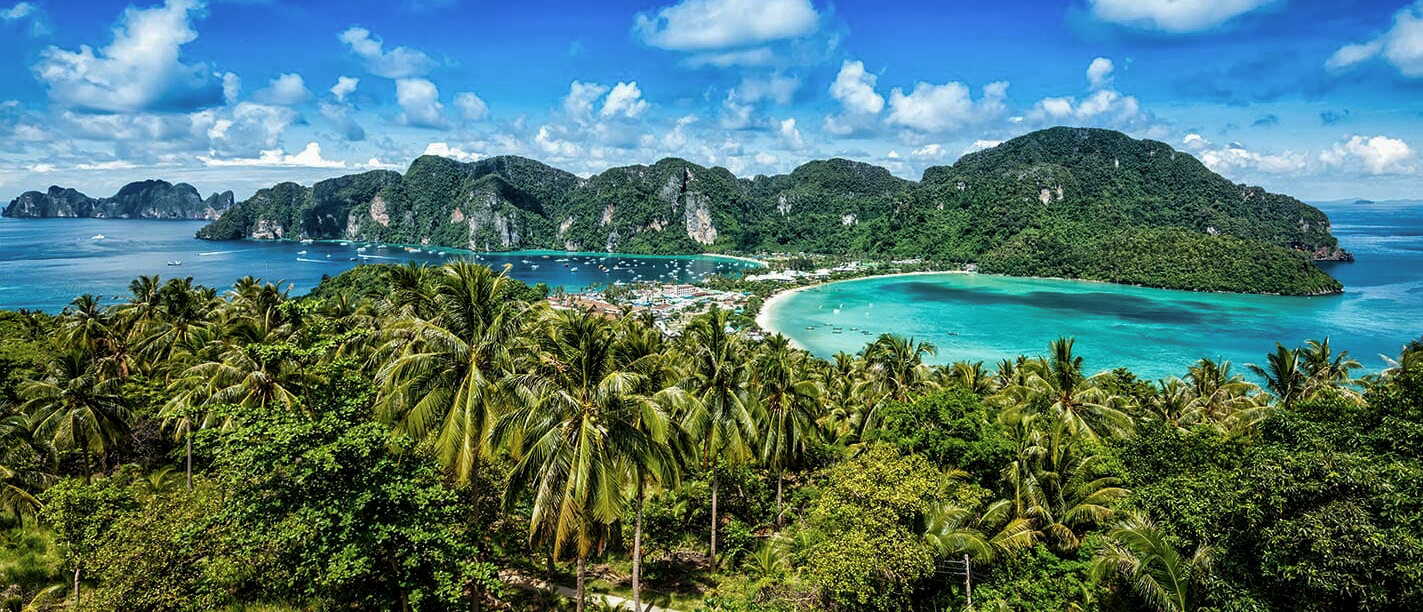Beautiful Phi Phi Islands vista with lush jungle, twin turquoise bays, and dramatic limestone cliffs.