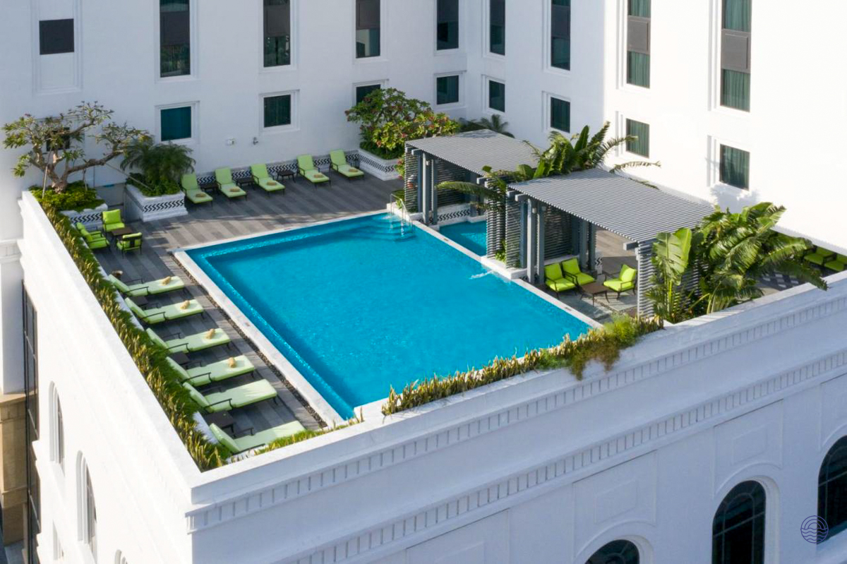 The inviting rooftop pool and lounge area at Mai House Saigon Hotel, Ho Chi Minh City.
