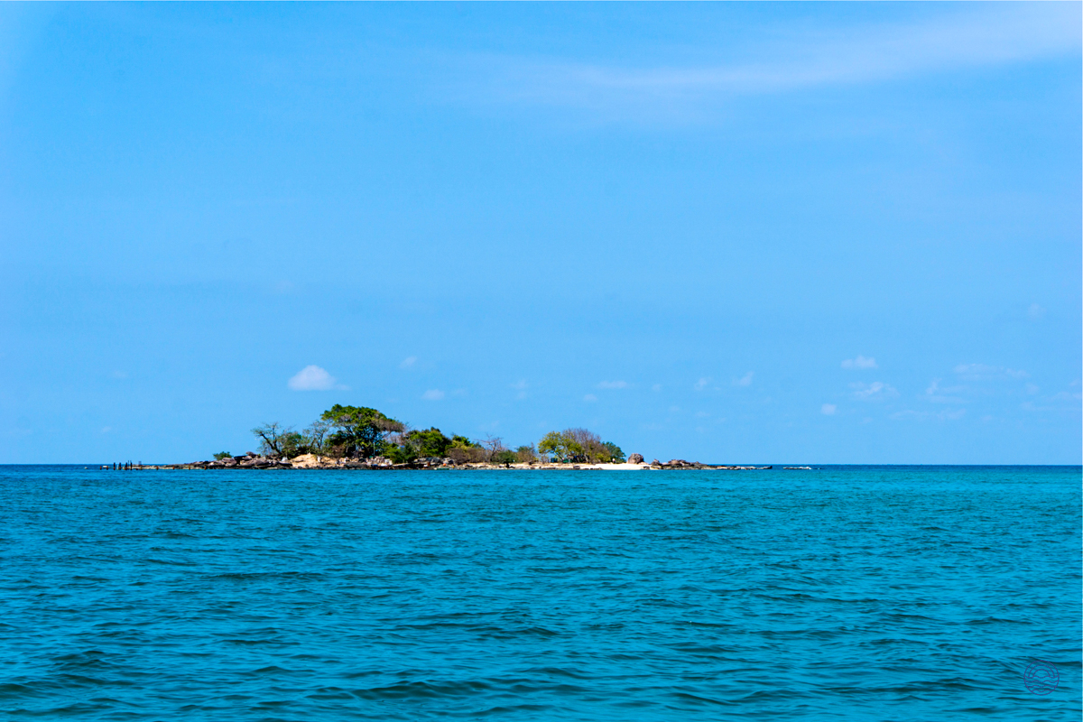 A tiny, lush island with a pristine white sand beach in the turquoise waters near Phu Quoc.