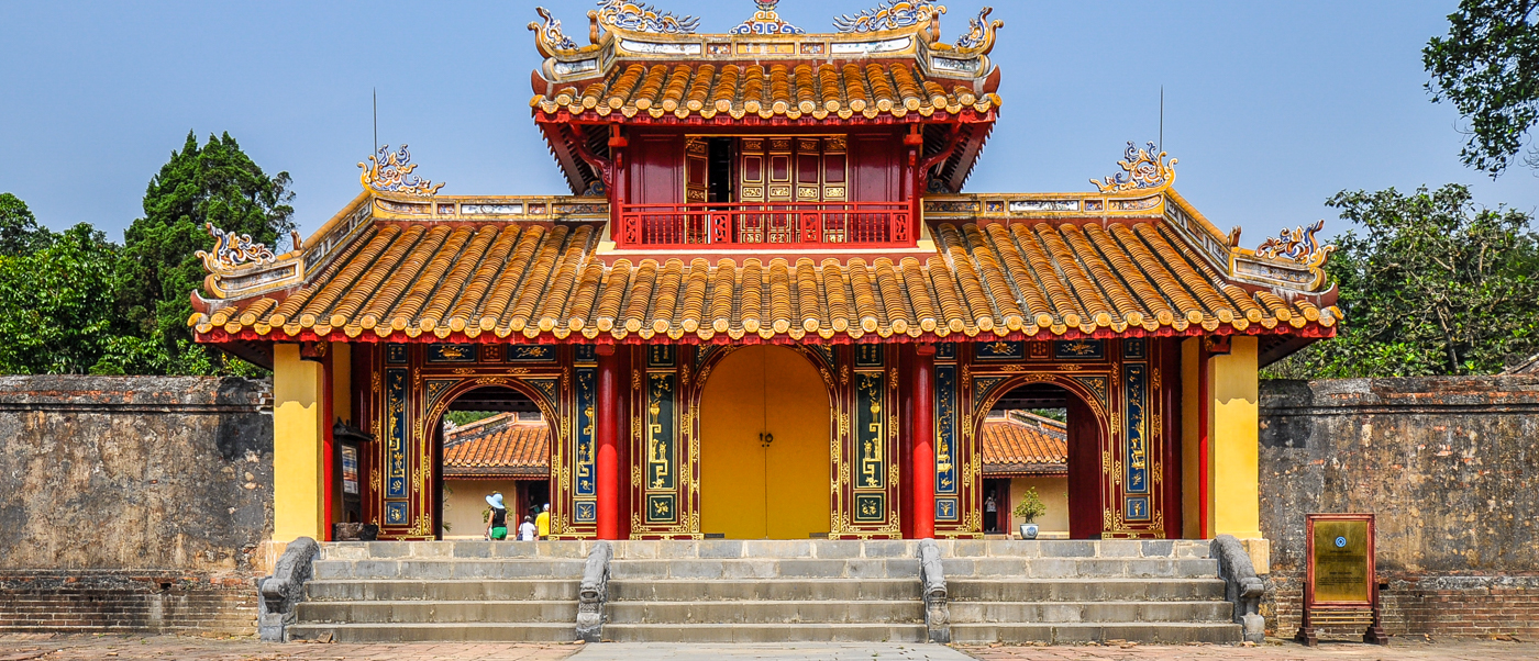 The grand, ornate entrance to Hue's Imperial Citadel, featuring a golden roof and red accents.